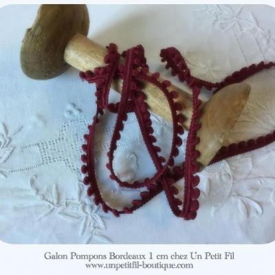 Galon pompons bordeaux un petit fil